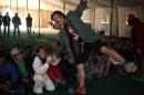 Clowns help Syrian camp children smile for moment
