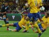 Theo Walcott (left) strikes to score a goal during the Euro 2012 match against Sweden at the Olympic stadium in Kiev