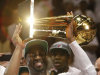 Miami Heat shooting guard Dwyane Wade holds the the Larry O'Brien NBA Championship Trophy after Game 5 of the NBA finals basketball series against the Oklahoma City Thunder, Friday, June 22, 2012, in Miami. The Heat won 121-106 to become the 2012 NBA Champions.(AP Photo/Lynne Sladky)
