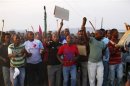Striking platinum mineworkers gather for a report back on negotiations at Lonmin's Marikana mine in South Africa's North West Province