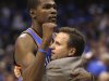Oklahoma City Thunder Kevin Durant, left, hugs head coach Scott Brooks in the final seconds of Game 4 in a first-round NBA basketball playoff series against the Dallas Mavericks, Saturday, May 5, 2012, in Dallas. The Thunder won 103-97.  (AP Photo/LM Otero)