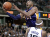 Los Angeles Lakers guard Kobe Bryant is fouled by Sacramento Kings center DeMarcus Cousins as he drives to the basket during the second half of an NBA basketball game in Sacramento, Calif., Wednesday, Nov. 21, 2012. The Kings won 113-97. (AP Photo/Rich Pedroncelli)