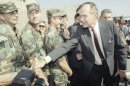 George H.W. Bush greets members army members after returning from a 30-day tour of the Middle East as part of Operation Desert Shield in 1990.
