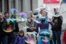 A woman blows giant bubbles in a street in the town of Appenzell, eastern Switzerland on April 28, 2013