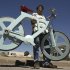 Israeli inventor Izhar Gafni holds his cardboard bicycle in Ahituv