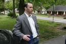 FILE - In this Tuesday April 23, 2013, file photo, James Everett Dutschke stands in the street near his home in Tupelo, Miss. A change-of-plea hearing is scheduled for Dutschke a man charged with sending poison-laced letters to President Barack Obama and other officials. James Everett Dutschke is scheduled for a hearing in U.S. District Court in Oxford on Friday afternoon, Jan. 17, 2014 according to court documents. (AP Photo/Northeast Mississippi Daily Journal, Thomas Wells, File) MANDATORY CREDIT