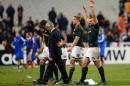 South Africa's hooker Bismarck Du Plessis (front R) celebrates at the end of the rugby union test match France vs South Africa at the Stade de France in Saint Denis on November 23, 2013