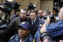Oscar Pistorius leaves court after the second day of the trial of the Olympic and Paralympic track star at the North Gauteng High Court in Pretoria