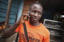 Man makes a call on a mobile phone in Sierra Leone's capital Freetown