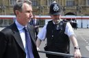 British Conservative MP and Deputy House of Commons Speaker Nigel Evans makes a news statement outside of the Houses of Parliament in London