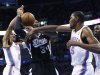 Oklahoma City Thunder forward Kevin Durant (35) knocks the ball away from Sacramento Kings forward Jason Thompson (34) in front of teammate guard Russell Westbrook (0) during the second quarter of an NBA basketball game in Oklahoma City, Friday, Dec. 14, 2012. (AP Photo/Sue Ogrocki)