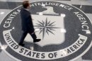 A man crosses the Central Intelligence Agency logo in the agency's lobby in Langley, Virginia, on August 14, 2008