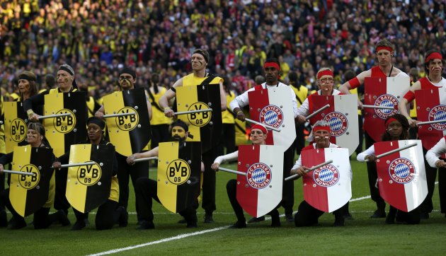 Performers take part in the opening ceremony before the start of the Champions League Final soccer match between Bayern Munich and Borussia Dortmund at Wembley Stadium in London