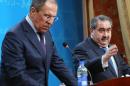 Russian Foreign Minister Sergei Lavrov (L) and his Iraqi counterpart Hoshyar Zebari give a joint press conference following a meeting in Baghdad on February 20, 2014