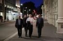 Head of the Iranian Atomic Energy Organization Ali Akbar Salehi (2nd R) walks near the hotel where the Iran nuclear talks are being held in Vienna on July 4, 2015