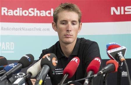 Photo: Andy Schleck looks down as he addresses a news conference in Luxembourg .