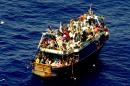 Migrants on a boat on the Mediterranean Sea are shown after being rescued on August 3, 2014 in this Italian Navy photo