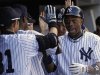 New York Yankees' Granderson is congratulated by teammates after hitting two-run home run against Tampa Bay Rays in New York