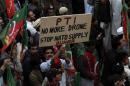 Supporters of Pakistan Tehreek-e-Insaf of Imran Khan protest during a rally to stop NATO supply routes into Afghanistan and drone attacks, in Peshawar