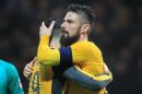 Arsenal's French striker Olivier Giroud (R) embraces teammate Granit Xhaka after their English FA Cup match against Preston North on January 7, 2016