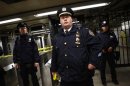 Police officers are seen at a closed subway station in New York
