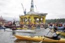 Activists protest the Shell Oil Company's drilling rig Polar Pioneer which is parked at Terminal 5 at the Port of Seattle, Washington