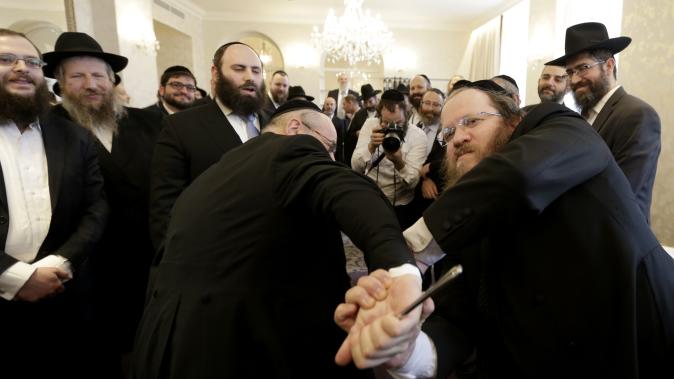 Rabbis take part in a first aid training during the Conference of European Rabbis in Prague, Czech Republic, Tuesday, Feb. 24, 2015. Due to the recent attacks on Jewish communities in Europe, part of the conference was a self defense and first aid training. [AP Photo/Petr David Josek)