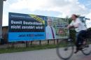 Election posters of the right-wing Alternative for Germany (AfD) and Social Democratic Party (SPD) are seen in Greifswald
