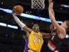 Los Angeles Lakers guard Kobe Bryant, left, goes up for a shot as Portland Trail Blazers center Meyers Leonard defends during the first half of their NBA basketball game, Friday, Feb. 22, 2013, in Los Angeles. (AP Photo/Mark J. Terrill)