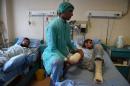 Medical staff treat wounded Afghan National Army soldiers at Sardar Mohammed Daoud Khan Military Hospital in Kabul