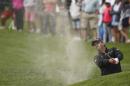 Jason Day, from Australia, shoot from the bunker on the sixth hole of the south course at Torrey Pines during the final round of the Farmers Insurance Open golf tournament Sunday, Feb. 8, 2015, in San Diego. (AP Photo/Lenny Ignelzi)