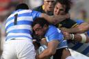 Argentina's Los Pumas number 8 Facundo Isa (C) is tackled by South Africa's lock Lood de Jager (L) and prop Tendai Mtawarira during their Rugby Championship match at Padre Ernesto Martearena stadium in Salta, Argentina on August 27, 2016