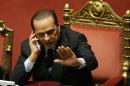 FILE - In this Tuesday, Dec. 14, 2010 file photo, Silvio Berlusconi gestures as he speaks on a mobile phone prior to a parliament debate, at the Senate in Rome, Italy. Berlusconi is among the world leaders who are trying to cope following allegations of massive electronic monitoring by the U.S. National Security Agency (AP Photo/Riccardo De Luca, File)