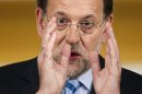 Spain's Prime Minister Mariano Rajoy speaks during a press conference at the Moncloa Palace, in Madrid, Sunday, June 10, 2012. Spain became the fourth and largest country to ask Europe to rescue its failing banks, a bailout of up to 100 billion euros ($125 billion) that leaders hoped would stabilize a financial crisis that threatens to break apart the 17-country eurozone. (AP Photo/Daniel Ochoa de Olza)