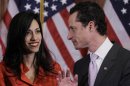 FILE - In this Jan. 5, 2011, file photo, Rep. Anthony Weiner, D-N.Y., and his wife, Huma Abedin, aide to Secretary of State Hillary Rodham Clinton, talk after a ceremonial swearing in of the 112th Congress on Capitol Hill in Washington. When Abedin's name and face first started appearing in the media six years ago, lots of people couldn't help but wonder what this beautiful, ambitious woman with high-fashion sense and a world-class rolodex saw in Anthony Weiner. That's a question New Yorkers are asking themselves again. (AP Photo/Charles Dharapak, File)