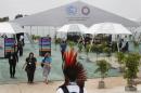 An indigenous participant walks during the U.N. Climate Change Conference COP20, in Lima