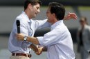 Republican vice presidential candidate Rep. Paul Ryan, R-Wis., left, hugs House Majority Leader Eric Cantor of Va., during a rally at the airport in Richmond, Va., Friday, Aug. 31, 2012. ( AP Photo/Steve Helber)