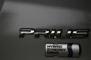 The logo of Toyota Motor Corp's Prius hybrid car is seen on its body at the company's showroom in Tokyo