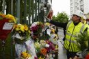 Floral tributes for Drummer Lee Rigby, of the British Army's 2nd Battalion The Royal Regiment of Fusiliers, are lined at the scene of his killing in Woolwich, southeast London