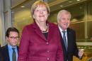 German chancellor Angela Merkel, center, arrives at a party convention of the Christian Social Union party, CSU, Bavarian only sister party of Merkel's Christian Democrats, accompanied by Bavarian governor Horst Seehofer, right, and CSU Secretary general, Andreas Scheuer , in Munich, southern Germany, Friday Nov. 20, 2015. .( Peter Kneffel/dpa via AP)