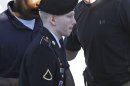 Army Pfc. Bradley Manning is escorted into a courthouse at Fort Meade, Md., Tuesday, June 4, 2013, before the second day of his court martial. Manning is charged with indirectly aiding the enemy by sending troves of classified material to WikiLeaks. He faces up to life in prison. (AP Photo/Patrick Semansky)