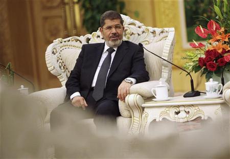 Egypt's President Mohamed Mursi speaks with China's Vice President Xi Jinping (not pictured) during their meeting at the Great Hall of the People, in Beijing August 29, 2012. REUTERS/How Hwee Young/Pool