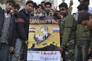 Demonstrators hold a placard during a protest in Kafranbel