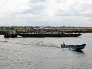 A man drives an outboard boat away from a jetty in Nigeria's oil-rich Niger Delta, December 2002. Pirates attacked a Greek-owned oil tanker off Nigeria Friday but failed to hijack the ship after the crew hid in a safe room, the International Maritime Bureau said