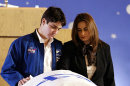 FILE - In this Feb. 10, 2003 file photo, Rona Ramon, right, and Assaf Ramon, left, widow and eldest son of Israel's first astronaut Ilan Ramon, pay their respects beside his coffin during a memorial service at Ben Gurion International Airport outside Tel Aviv. Ten years after the loss of her husband followed by the loss of her son Assaf six years later, Ramon, 48, said she has slowly tried to rebuild her life, leading a foundation formed in memory of her husband and son and counseling others who are coping with tragedy.(AP Photo/ Paul Hanna, Pool, File)