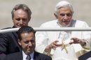 FILE -- In this photo taken Wednesday, May, 23, 2012, Pope Benedict XVI, flanked by his private secretary Georg Gaenswein, top left, and his butler Paolo Gabiele arrives at St.Peter's square at the Vatican for a general audience. Paolo Gabriele took the stand Tuesday, Oct. 2, 2012, in a Vatican courtroom to defend himself against a charge of aggravated theft. He said he is innocent of charges of stealing the pope's private correspondence but acknowledged he feels guilty of betraying the trust of the pontiff, whom he said he loved like a father. In other testimony Tuesday, the pope's private secretary, Monsignor Georg Gaenswein, testified that he began having suspicions about Gabriele after he realized three documents that appeared in the journalist's book could only have come from the office he shared with Gabriele. (AP Photo/Andrew Medichini, File)