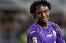 In this Sept. 24, 2014 file photo, Fiorentina's Juan Cuadrado reacts during a Serie A soccer match between Fiorentina and Sassuolo at the Artemio Franchi stadium in Florence. Fiorentina coach Vincenzo Montella has confirmed Friday, Jan. 30, 2015, Juan Cuadrado is set to complete a move to Chelsea, with Mohamed Salah moving on loan in the opposite direction. Cuadrado is expected to undergo a medical in London on Saturday ahead of signing a permanent deal with the Premier League club. (AP Photo/Fabrizio Giovannozzi, file)