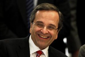 Greek PM Samaras smiles during an Economist conference in Athens