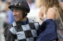 Jockey Frankie Dettori carries his saddle after riding Beatrice Aurore during the first race at the Epsom Derby Festival in Surrey, southern England, on May 31, 2013