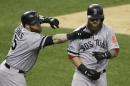 Boston Red Sox's Jonny Gomes reaches to pull the beard of Mike Napoli after Napoli hits a home run in the seventh inning during Game 3 of the American League baseball championship series against the Detroit Tigers Tuesday, Oct. 15, 2013, in Detroit. (AP Photo/Carlos Osorio)